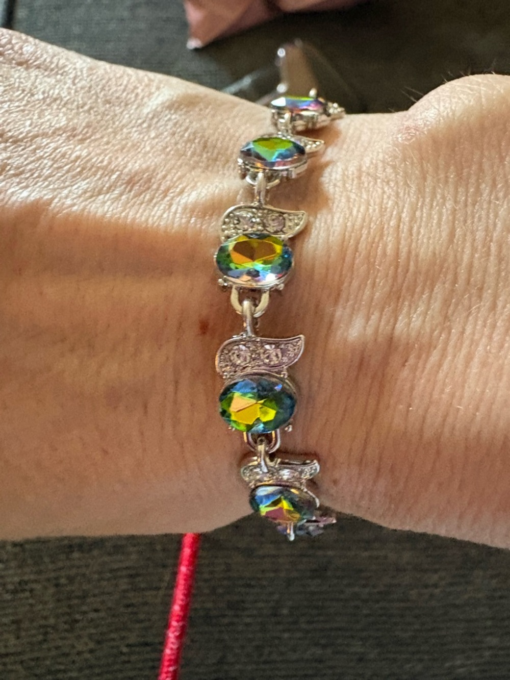 Rainbow Mystic Topaz bracelet featuring rhinestone embellished links